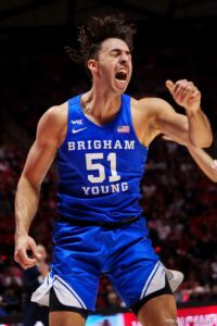 (Trent Nelson  |  The Salt Lake Tribune) Brigham Young Cougars forward Gavin Baxter (51) dunks the ball as the Utah Utes host BYU, NCAA basketball in Salt Lake City on Saturday, Nov. 27, 2021.