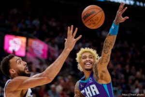 (Trent Nelson  |  The Salt Lake Tribune) Charlotte Hornets guard Kelly Oubre Jr. (12) reaches out for a pass going to Utah Jazz center Rudy Gobert (27) as the Utah Jazz host the Charlotte Hornets, NBA basketball in Salt Lake City on Monday, Dec. 20, 2021.