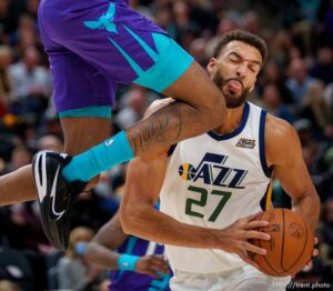 (Trent Nelson  |  The Salt Lake Tribune) Utah Jazz center Rudy Gobert (27) defended by Charlotte Hornets forward Jalen McDaniels (6) as the Utah Jazz host the Charlotte Hornets, NBA basketball in Salt Lake City on Monday, Dec. 20, 2021.