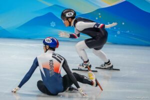 (Trent Nelson  |  The Salt Lake Tribune) Andrew Heo (USA) races around Janghyuk Park (Korea) in the 1000m, short track speed skating at the 2022 Winter Olympics in Beijing on Monday, Feb. 7, 2022.