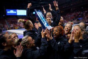 (Trent Nelson  |  The Salt Lake Tribune) Utah celebrates with the Pac-12 championship trophy at the Pac-12 gymnastics championships at the Maverik Center in West Valley City on Saturday, March 19, 2022.