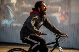 guy riding bike down 1700 south with a knife on Thursday, March 17, 2022.