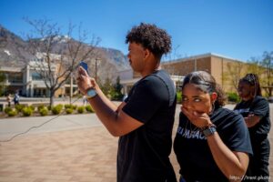 (Trent Nelson  |  The Salt Lake Tribune) Rachel Weaver reacts to questions about immigration as the Black Menaces film a TikTok video at BYU in Provo on Friday, April 8, 2022. Filming is Sebastian Stewart-Johnson and at far right is Kennethia Dorsey.