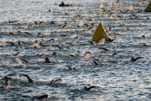 (Trent Nelson  |  The Salt Lake Tribune) Competitors swim at Sand Hollow Reservoir to start the Ironman World Championship triathlon in St. George on Saturday, May 7, 2022.