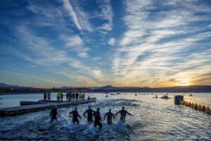 (Trent Nelson  |  The Salt Lake Tribune) Competitors rush into the water at in the Ironman World Championship triathlon in St. George on Saturday, May 7, 2022.