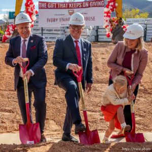 (Trent Nelson  |  The Salt Lake Tribune) Marigold Bertha (a young member of the Ivory family) gets a headstart ahead of other dignatariees at the groundbreaking ceremony for Ivory University House at the University of Utah in Salt Lake City on Friday, May 13, 2022. From left are University of Utah President Taylor Randall, Clark Ivory, and Christine Ivory.