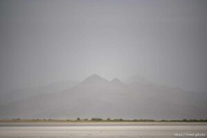 (Trent Nelson  |  The Salt Lake Tribune) Dust obscures Antelope Island and the Great Salt Lake on Saturday, June 18, 2022.