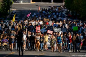(Trent Nelson  |  The Salt Lake Tribune) People march up West Temple during a protest in Salt Lake City after the U.S. Supreme Court overruled Roe v. Wade, on Friday, June 24, 2022.