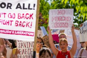 (Trent Nelson  |  The Salt Lake Tribune) People march through downtown Provo, protesting after the U.S. Supreme Court overruled Roe v. Wade, on Saturday, June 25, 2022.