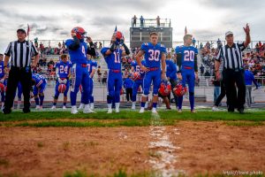 (Trent Nelson  |  The Salt Lake Tribune) Team captains for Water Canyon High School line up for the coin toss, before facing Grand County in Hildale on Friday, Aug. 12, 2022. From left are Dylan Horsley, Nick Timpson, Lester Barlow, and Johnny Timpson.
