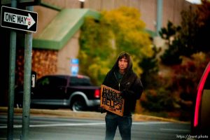 guy with sign,  on Saturday, Oct. 22, 2022.