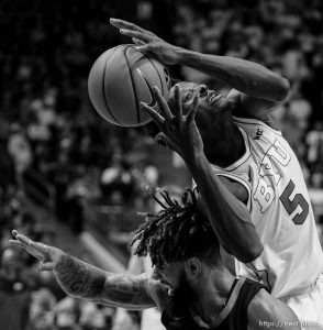 (Trent Nelson  |  The Salt Lake Tribune) Pacific Tigers guard Donovan Williams (1) and Brigham Young Cougars forward Gideon George (5) as BYU hosts Pacific, NCAA basketball in Provo on Saturday, Feb. 4, 2023.