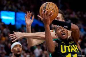 (Trent Nelson  |  The Salt Lake Tribune) Utah Jazz guard Kris Dunn (11) pulls down a rebound as the Utah Jazz host the San Antonio Spurs, NBA basketball in Salt Lake City on Saturday, Feb. 25, 2023.