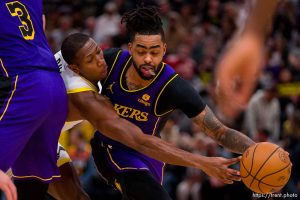 (Trent Nelson  |  The Salt Lake Tribune) Utah Jazz guard Kris Dunn (11) reaches for a steal on Los Angeles Lakers guard D'Angelo Russell (1) as the Utah Jazz host the Los Angeles Lakers, NBA basketball in Salt Lake City on Saturday, Jan. 13, 2024.