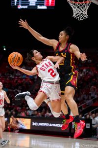 (Trent Nelson  |  The Salt Lake Tribune) Utah Utes guard Ines Vieira (2) is defended by USC Trojans guard Dominique Darius (21) as Utah hosts USC, NCAA basketball in Salt Lake City on Friday, Jan. 19, 2024.