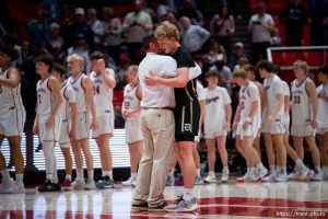 (Trent Nelson  |  The Salt Lake Tribune) 
Davis Coach Chad Sims embraces Zach Fisher as Herriman defeats Davis  in the 6A high school boys basketball tournament in Salt Lake City on Monday, Feb. 26, 2024.