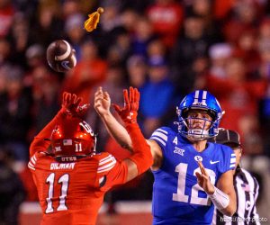 (Trent Nelson  |  The Salt Lake Tribune) Brigham Young Cougars quarterback Jake Retzlaff (12) throws the ball as a flag is thrown as Utah hosts BYU, NCAA football in Salt Lake City on Saturday, Nov. 9, 2024.