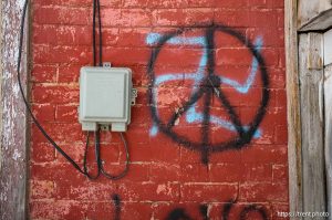 peace sign over swastika, Abandoned Home, Eureka, desert drive on Sunday, Feb. 23, 2025.