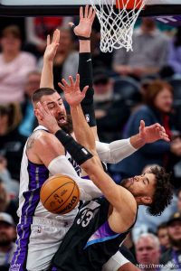 (Trent Nelson  |  The Salt Lake Tribune) Utah Jazz guard Johnny Juzang (33) and Sacramento Kings center Jonas Valanciunas (17) collide as the Utah Jazz host the Sacramento Kings, NBA basketball in Salt Lake City on Wednesday, Feb. 26, 2025.