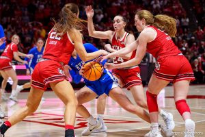 (Trent Nelson  |  The Salt Lake Tribune) Utah defenders strip the ball from BYU Cougars guard Delaney Gibb (11) in the final seconds as Utah hosts BYU, NCAA basketball in Salt Lake City on Saturday, March 1, 2025.