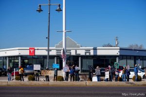 (Trent Nelson  |  The Salt Lake Tribune) People protest Elon Musk and DOGE at the South Salt Lake Tesla dealership on Saturday, March 1, 2025.