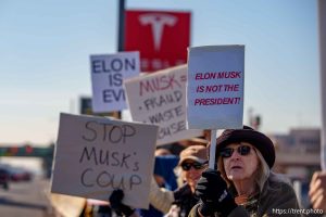 (Trent Nelson  |  The Salt Lake Tribune) People protest Elon Musk and DOGE at the South Salt Lake Tesla dealership on Saturday, March 1, 2025.