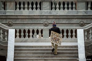 (Trent Nelson  |  The Salt Lake Tribune) A protestor carries a sign reading, 