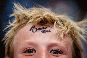(Trent Nelson  |  The Salt Lake Tribune) A young fan autographed by the Jazz Bear as the Utah Jazz host the Oklahoma City Thunder, NBA basketball in Salt Lake City on Friday, April 11, 2025.