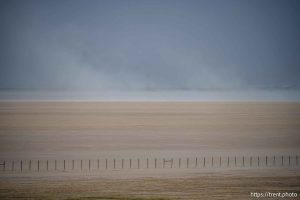 (Trent Nelson  |  The Salt Lake Tribune) Dust blows over the Great Salt Lake on Monday, May 12, 2025.
