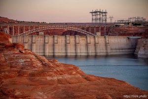 (Trent Nelson  |  The Salt Lake Tribune) Glen Canyon Dam and high-voltage transmission towers in Page, Ariz. on Tuesday, May 20, 2025.