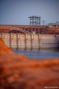 (Trent Nelson  |  The Salt Lake Tribune) Glen Canyon Dam and high-voltage transmission towers in Page, Ariz. on Tuesday, May 20, 2025.