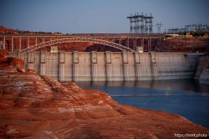 (Trent Nelson  |  The Salt Lake Tribune) Glen Canyon Dam and high-voltage transmission towers in Page, Ariz. on Tuesday, May 20, 2025.