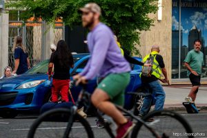 (Trent Nelson | The Salt Lake Tribune) A man lays injured on the street as police respond to a reported shooting during a protest march in Salt Lake City, Saturday, June 14, 2025. I took these photos to capture the immediate scene in all directions.