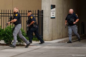 (Trent Nelson | The Salt Lake Tribune) A man lays injured on the street as police respond to a reported shooting during a protest march in Salt Lake City, Saturday, June 14, 2025.