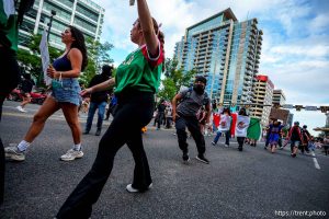 (Trent Nelson | The Salt Lake Tribune) People run after three shots were fired during 'No Kings' protest march in Salt Lake City, Saturday, June 14, 2025.