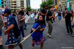(Trent Nelson | The Salt Lake Tribune) People run after three shots were fired during 'No Kings' protest march in Salt Lake City, Saturday, June 14, 2025.