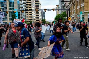 (Trent Nelson | The Salt Lake Tribune) People run after three shots were fired during 'No Kings' protest march in Salt Lake City, Saturday, June 14, 2025.