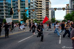(Trent Nelson | The Salt Lake Tribune) People run after three shots were fired during 'No Kings' protest march in Salt Lake City, Saturday, June 14, 2025.