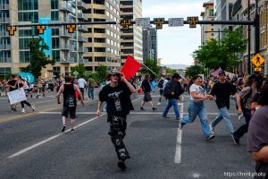 (Trent Nelson | The Salt Lake Tribune) People run after three shots were fired during 'No Kings' protest march in Salt Lake City, Saturday, June 14, 2025.
