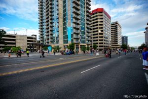 (Trent Nelson | The Salt Lake Tribune) A man lays injured on the street as police respond to a reported shooting during a protest march in Salt Lake City, Saturday, June 14, 2025.