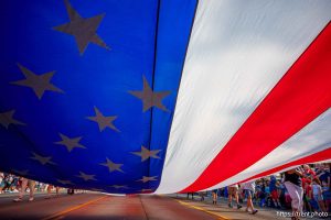 (Trent Nelson  |  The Salt Lake Tribune) A large flag is carried down University Avenue at the Grand Parade for AmericaÕs Freedom Festival in Provo on Friday, July 4, 2025.