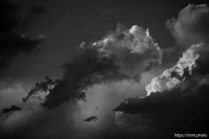 (Trent Nelson  |  The Salt Lake Tribune) clouds at sunset over the Bingham Copper Mine, and planes Draper on Wednesday, July 9, 2025.