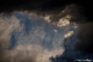 (Trent Nelson  |  The Salt Lake Tribune) clouds at sunset over the Bingham Copper Mine, and planes Draper on Wednesday, July 9, 2025.