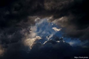 (Trent Nelson  |  The Salt Lake Tribune) clouds at sunset over the Bingham Copper Mine, and planes Draper on Wednesday, July 9, 2025.