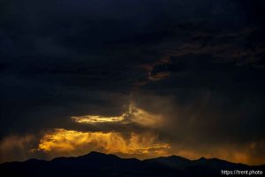 (Trent Nelson  |  The Salt Lake Tribune) clouds at sunset over the Bingham Copper Mine, and planes Draper on Wednesday, July 9, 2025.