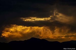 (Trent Nelson  |  The Salt Lake Tribune) clouds at sunset over the Bingham Copper Mine, and planes Draper on Wednesday, July 9, 2025.