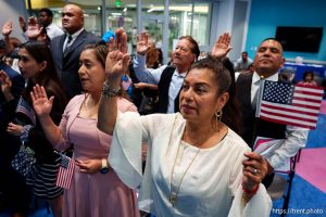 (Trent Nelson  |  The Salt Lake Tribune) Citizens recite the Oath of Allegiance at a naturalization ceremony in Kearns on Tuesday, Aug. 5, 2025.
