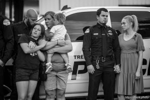 (Trent Nelson  |  The Salt Lake Tribune) Police officers and family members at a vigil in Tremonton on Tuesday, Aug. 19, 2025 to honor two city police officers who were killed and a sheriff’s deputy who was wounded two days earlier in a shooting.