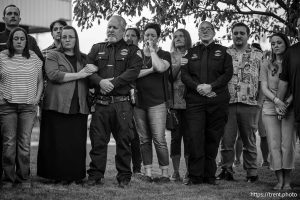 (Trent Nelson  |  The Salt Lake Tribune) Police officers and family members at a vigil in Tremonton on Tuesday, Aug. 19, 2025 to honor two city police officers who were killed and a sheriff’s deputy who was wounded two days earlier in a shooting.