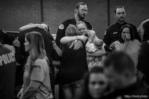 (Trent Nelson  |  The Salt Lake Tribune) Police officers and family members at a vigil in Tremonton on Tuesday, Aug. 19, 2025 to honor two city police officers who were killed and a sheriff’s deputy who was wounded two days earlier in a shooting.